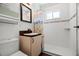 Bathroom featuring a tiled shower and modern vanity at 2610 58Th S St, Gulfport, FL 33707