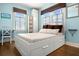 Bright bedroom with light blue walls and ample natural light at 2610 58Th S St, Gulfport, FL 33707