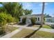 Charming single story home with well-manicured lawn and walkway in a tropical landscaped neighborhood at 2610 58Th S St, Gulfport, FL 33707
