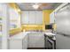 Efficient kitchen with white cabinetry and stainless steel appliances at 2610 58Th S St, Gulfport, FL 33707