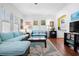 Bright living room features hardwood floors and comfortable seating at 2610 58Th S St, Gulfport, FL 33707