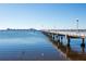 Scenic view of the pier extending into the calm, blue water, inviting peaceful strolls and views at 2610 58Th S St, Gulfport, FL 33707