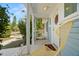 Inviting front porch with chairs offers a cozy outdoor seating area at 2610 58Th S St, Gulfport, FL 33707