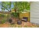 Cozy backyard with fire pit, outdoor seating and leafy ground cover, creating a relaxing outdoor space at 2708 N Mitchell Ave, Tampa, FL 33602
