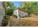 Expansive backyard with lawn, patio furniture, and barbecue for outdoor enjoyment at 2708 N Mitchell Ave, Tampa, FL 33602
