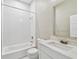 Clean bathroom features white subway tile, a shower, a toilet, and a vanity with a mirror at 2708 N Mitchell Ave, Tampa, FL 33602
