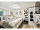 Charming bedroom featuring a comfortable bed, soft lighting, and unique decor, creating a relaxing atmosphere at 2708 N Mitchell Ave, Tampa, FL 33602