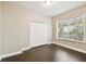 Bright bedroom has hardwood floors, a closet, and a window to bring in natural light at 2708 N Mitchell Ave, Tampa, FL 33602
