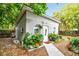 Back exterior with flourishing plants that enhance this cozy home at 2708 N Mitchell Ave, Tampa, FL 33602