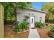 Charming exterior with lush greenery, decorative plants, and a cozy, inviting entrance at 2708 N Mitchell Ave, Tampa, FL 33602