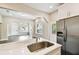 Bright kitchen features stainless steel appliances, light countertops, and an eat-in island with a sink at 2708 N Mitchell Ave, Tampa, FL 33602
