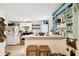 Open-concept kitchen with modern appliances, breakfast bar, and convenient laundry area at 2708 N Mitchell Ave, Tampa, FL 33602