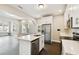 Bright kitchen has stainless steel appliances, light countertops, and an eat-in island with a sink at 2708 N Mitchell Ave, Tampa, FL 33602