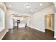 Open-concept living space with a modern kitchen and hardwood floors at 2708 N Mitchell Ave, Tampa, FL 33602