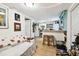 Cozy living room with hardwood flooring and a seamless connection to a modern kitchen at 2708 N Mitchell Ave, Tampa, FL 33602