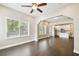 Bright living room featuring hardwood floors and large windows for ample natural light at 2708 N Mitchell Ave, Tampa, FL 33602