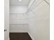 Large walk-in closet features wrap around metal shelving and hardwood floors at 2708 N Mitchell Ave, Tampa, FL 33602