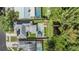 Overhead view showcasing the pool, pond with bridge, and the landscaped backyard at 2779 Diane Ter, Clearwater, FL 33759