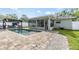 Backyard oasis with a pool, patio, and landscaping for outdoor relaxation and enjoyment at 2779 Diane Ter, Clearwater, FL 33759