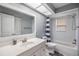 Bathroom featuring a single sink vanity with a shower and tub combination at 2779 Diane Ter, Clearwater, FL 33759