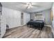 Bright bedroom features wood floors, white closets, neutral paint, and a ceiling fan at 2779 Diane Ter, Clearwater, FL 33759