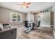 Inviting dining area with hardwood floors, modern table, and a comfortable seating area with a sofa at 2779 Diane Ter, Clearwater, FL 33759