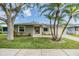 Charming single-story home with well-manicured lawn and mature palm trees in a desirable neighborhood at 2779 Diane Ter, Clearwater, FL 33759
