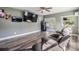 Spacious living room offers wood floors, neutral paint, large windows, and an entertainment center at 2779 Diane Ter, Clearwater, FL 33759
