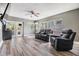 Inviting living room featuring wood floors, neutral paint, lots of windows, and comfortable seating at 2779 Diane Ter, Clearwater, FL 33759