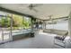Large screened-in patio with ceiling fans and access to the backyard pool area at 2779 Diane Ter, Clearwater, FL 33759