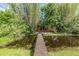 Scenic pond view featuring a wooden bridge, providing a serene escape into nature at 2779 Diane Ter, Clearwater, FL 33759