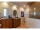 Serene bathroom features a tile shower and well-lit vanity with ample storage at 3 Paradise Ln, Treasure Island, FL 33706