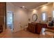 Open bathroom with large vanity and private toilet area at 3 Paradise Ln, Treasure Island, FL 33706