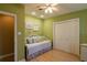 Light-filled bedroom with wicker daybed, closet, and neutral decor at 3 Paradise Ln, Treasure Island, FL 33706