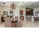 Elegant dining room with chandelier, adjacent bar and seating, perfect for gatherings at 3 Paradise Ln, Treasure Island, FL 33706