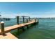A private boat dock on the water offers direct access for boating and other water activities at 3 Paradise Ln, Treasure Island, FL 33706