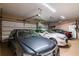 Three car garage featuring ample space for parking and overhead storage at 3 Paradise Ln, Treasure Island, FL 33706