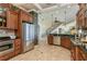 Updated kitchen with stainless steel appliances and a view to the staircase at 3 Paradise Ln, Treasure Island, FL 33706