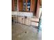Kitchen view with tile flooring, exposed framing and uppers and ladder at 3 Paradise Ln, Treasure Island, FL 33706