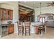 Kitchen featuring bar seating, granite counters and a view to the foyer and front entry at 3 Paradise Ln, Treasure Island, FL 33706
