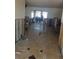 Open living space with tile flooring and exposed framing at 3 Paradise Ln, Treasure Island, FL 33706