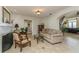Open living room featuring a fireplace, tile flooring, and views of the home's interior at 3 Paradise Ln, Treasure Island, FL 33706