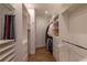 Bright walk-in closet features custom shelves, drawers, and hanging rods at 3 Paradise Ln, Treasure Island, FL 33706