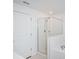 Modern bathroom showcases white subway tile, glass shower doors, and a tub at 32094 Pop Ash Pl, San Antonio, FL 33576