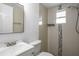 Bathroom featuring tile walls and floors with a shower at 3215 Corey Rd, Sarasota, FL 34232