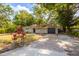 Charming single-story home featuring a well-maintained lawn and mature trees at 3215 Corey Rd, Sarasota, FL 34232