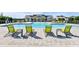 Relaxing community pool area with lounge chairs and umbrellas for residents' enjoyment at 3319 Guanabana Xing, Wesley Chapel, FL 33543