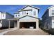 New construction featuring a two-story home with an attached garage, ready for customization and landscaping at 3319 Guanabana Xing, Wesley Chapel, FL 33543