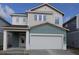 Inviting two-story home with a two-car garage and covered porch at 3319 Guanabana Xing, Wesley Chapel, FL 33543
