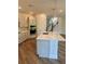 Bright, modern kitchen featuring a large island and stainless steel appliances at 3319 Guanabana Xing, Wesley Chapel, FL 33543